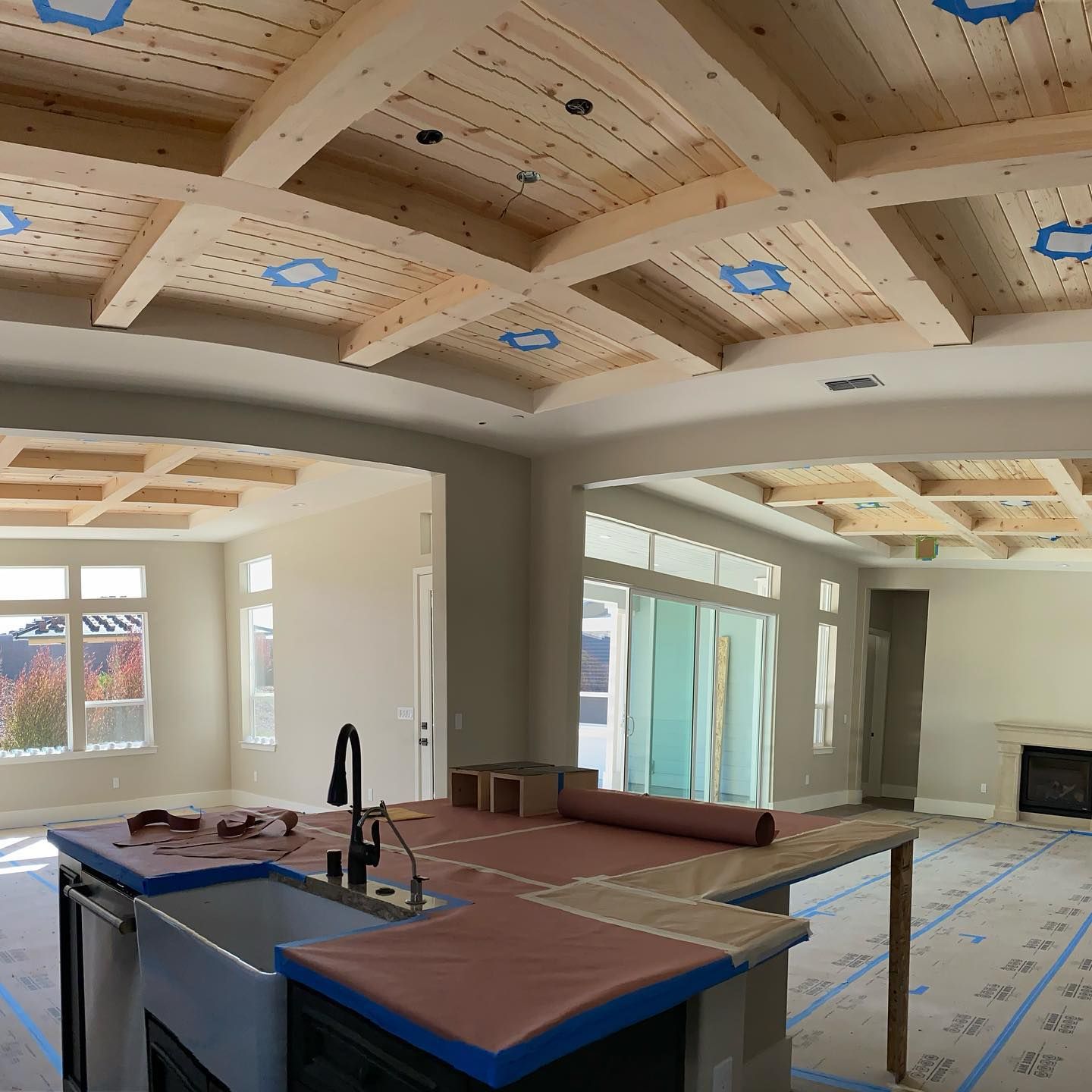 A wooden fence is sitting on top of a lush green field.