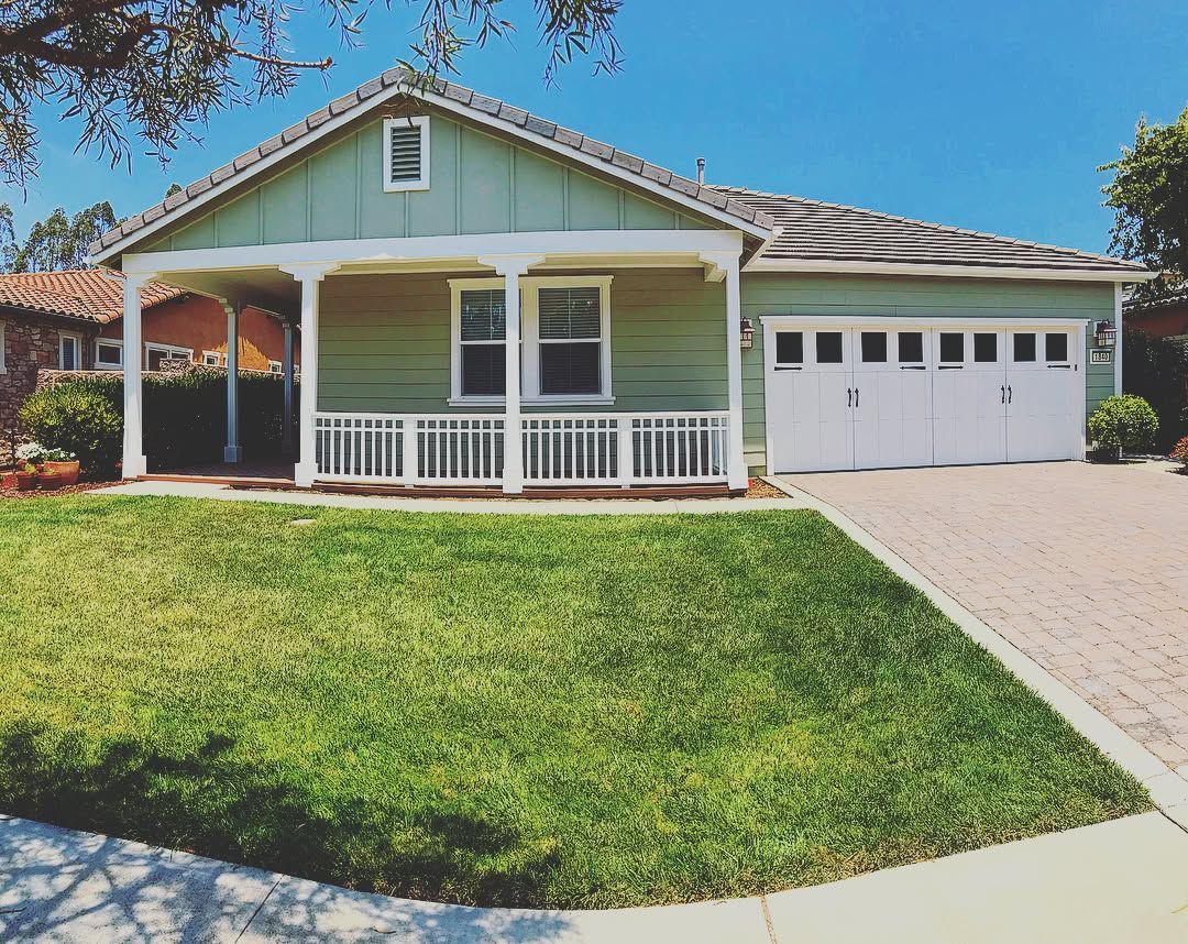 A wooden fence with a gate attached to it.