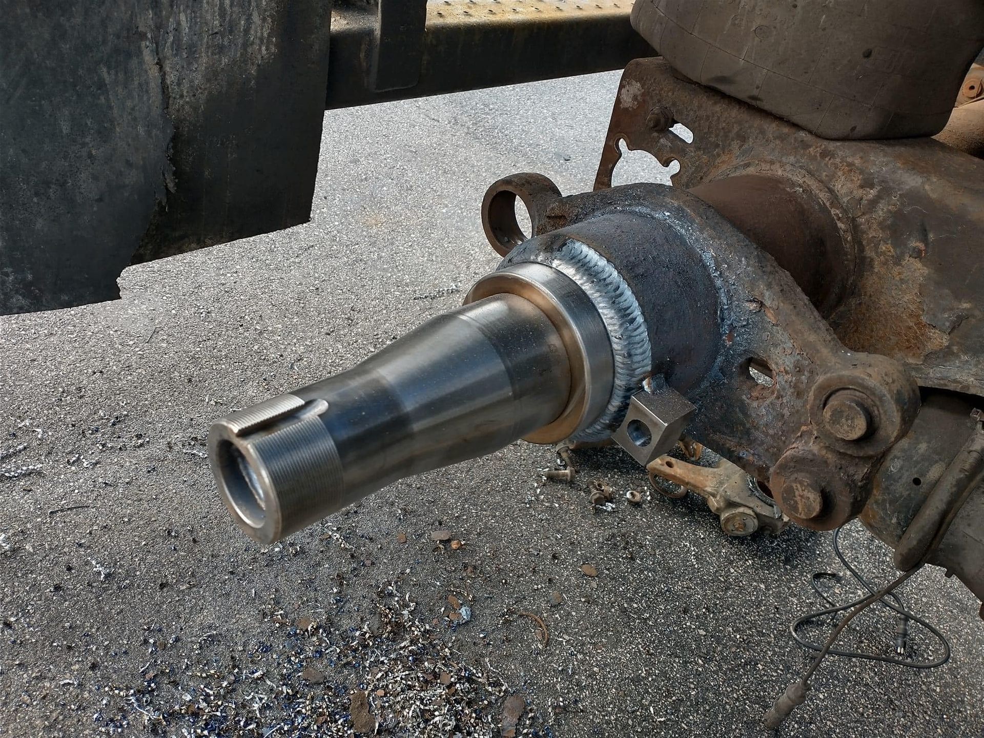 A close up of a metal object on the ground