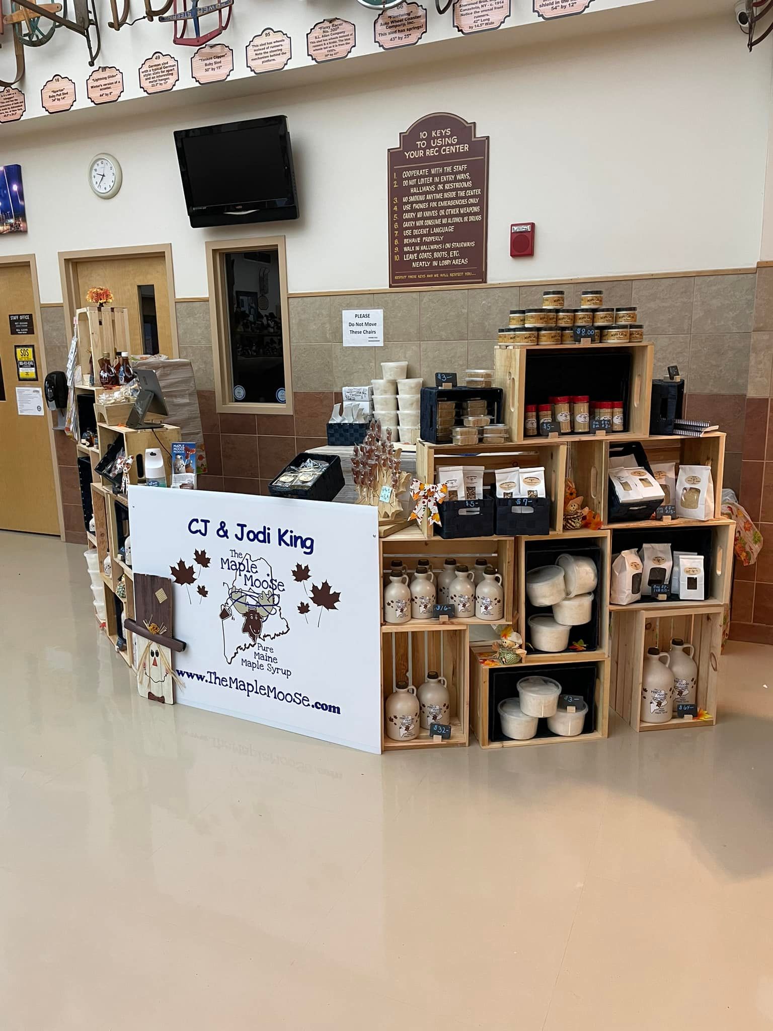 A retail display of food products made from wooden crates.