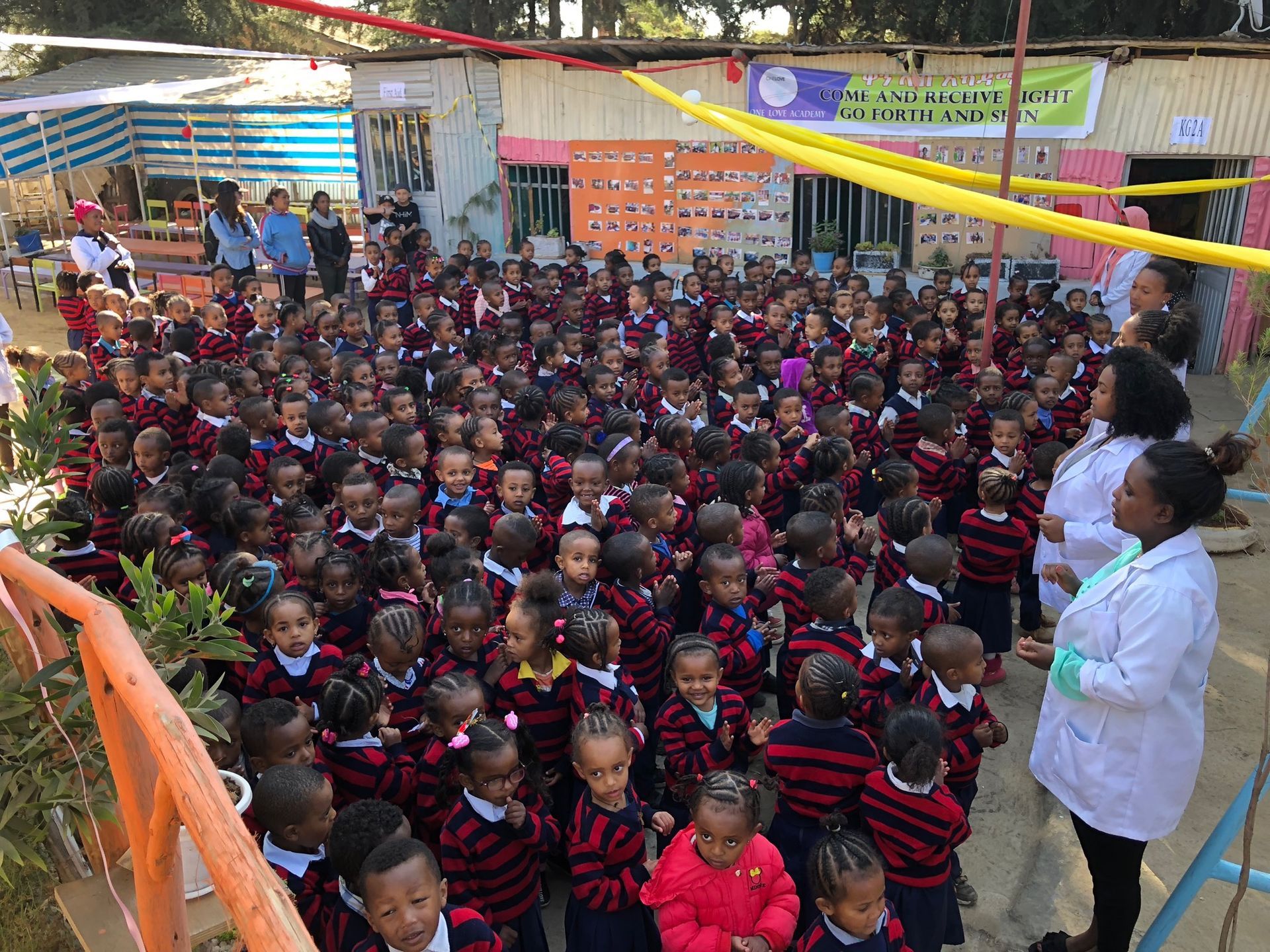 OneLove team serving the members of the community in Ethiopia and meeting the students