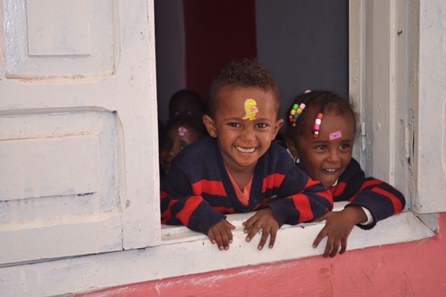 OneLove Ethiopia students smiling. One Love helps provide a safe education to students..