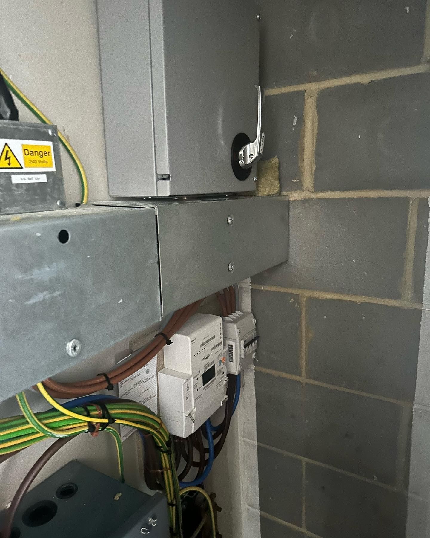 A gray box with a yellow caution sign on it