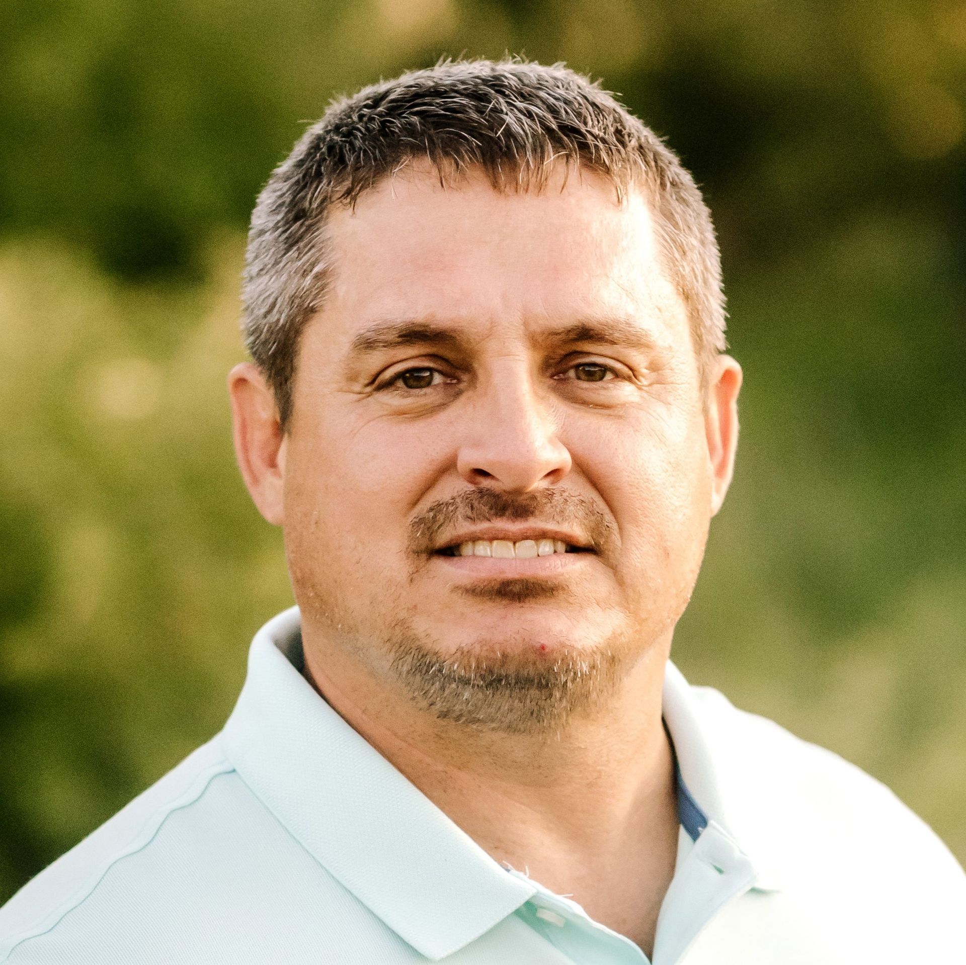 A silhouette of a person without a face on a gray background.