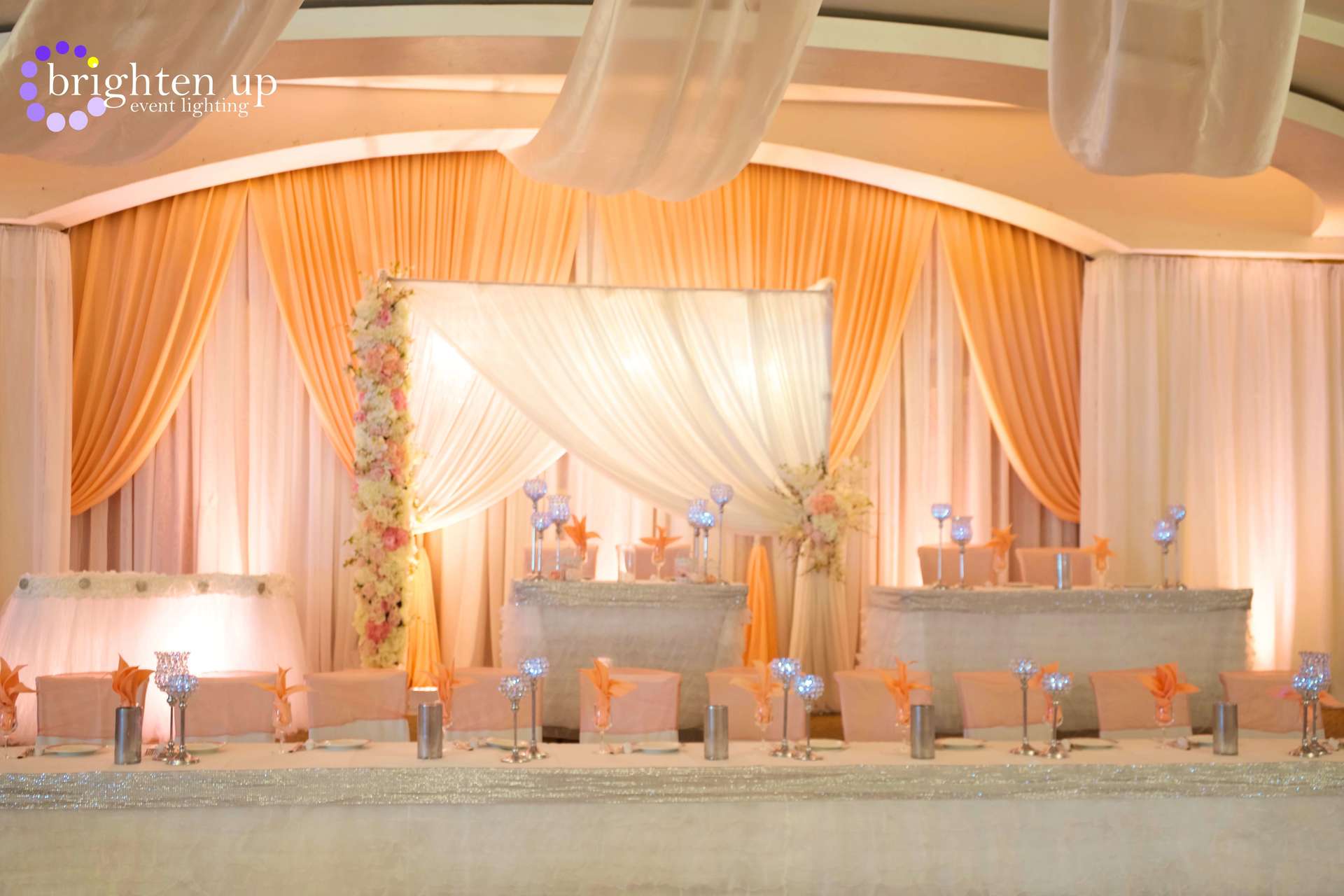 A brighten up logo can be seen on the back of a stage