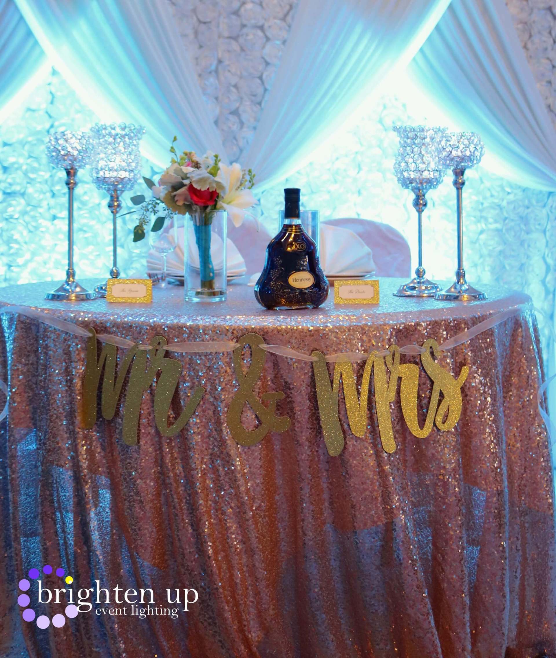 A table with a banner that says mr and mrs on it