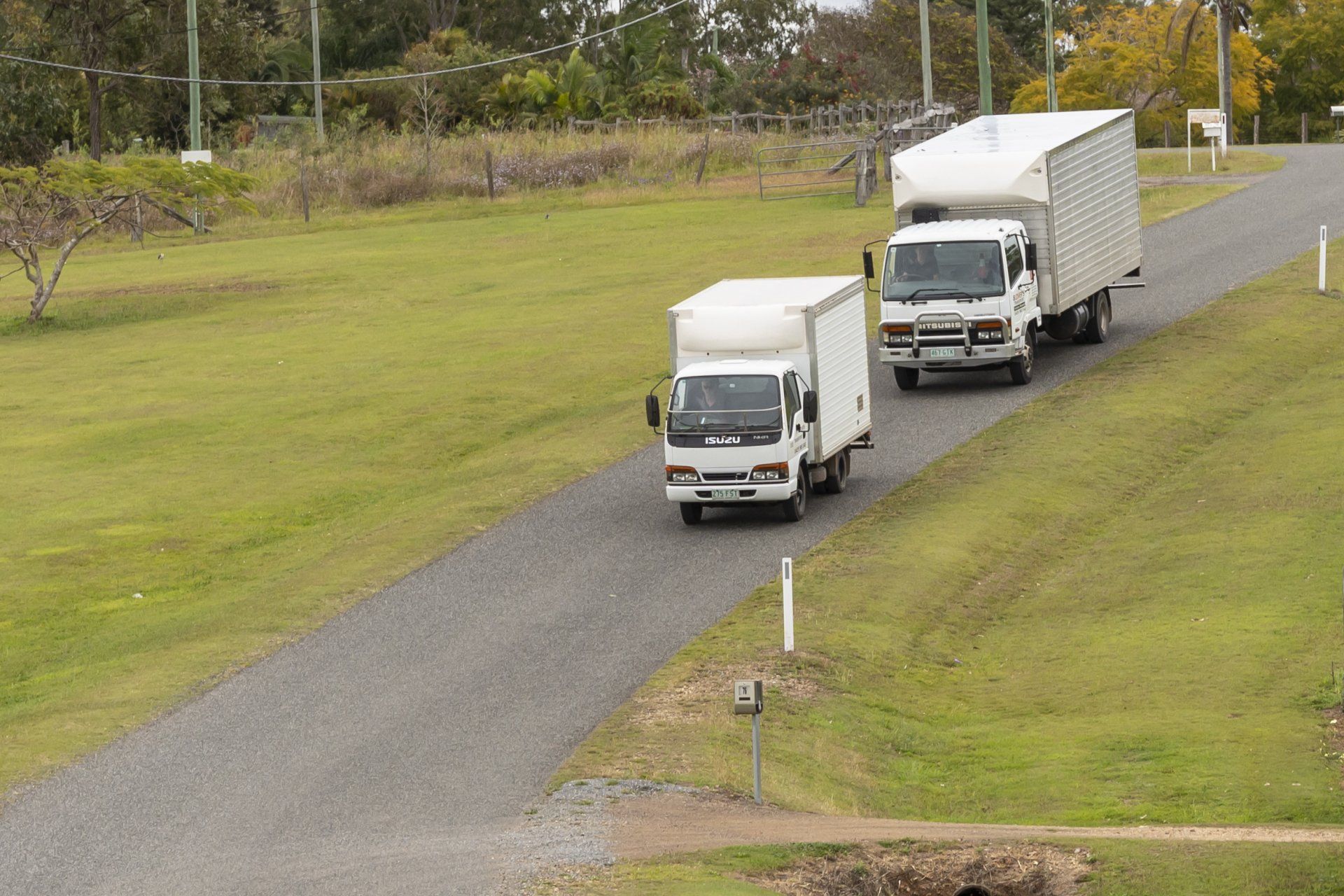 Trucks Driving Down The Road — Furniture Removals in Glenwood, QLD