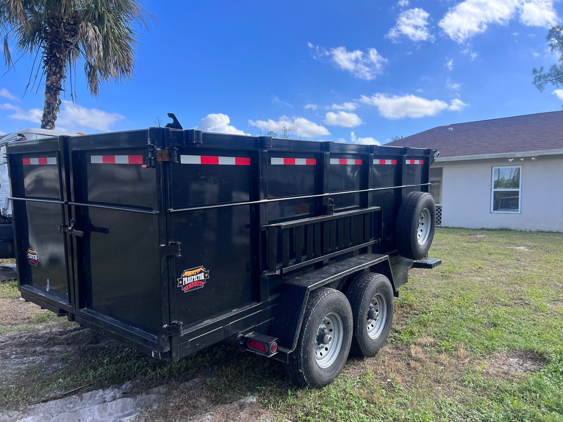Black Truck Removing Junk — Naples, FL — Affordable Pros Removal Services LLC