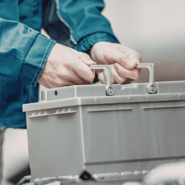 mechanic doing a battery replacement