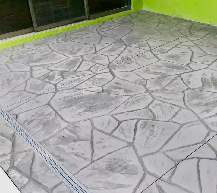 A concrete floor with a geometric pattern on it