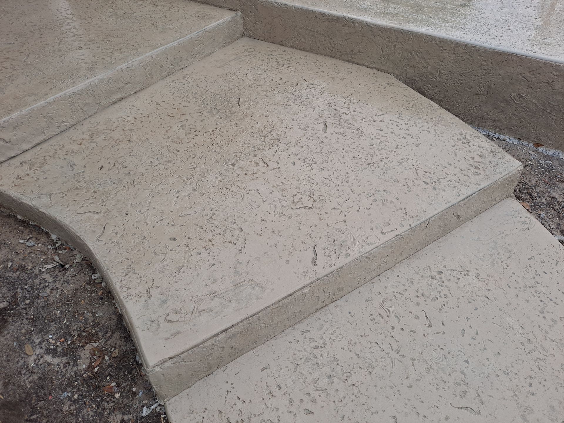 A close up of a set of stairs made of concrete.