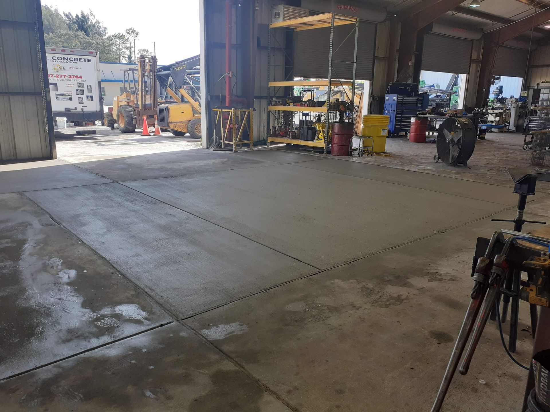 A large warehouse with a lot of machinery in it