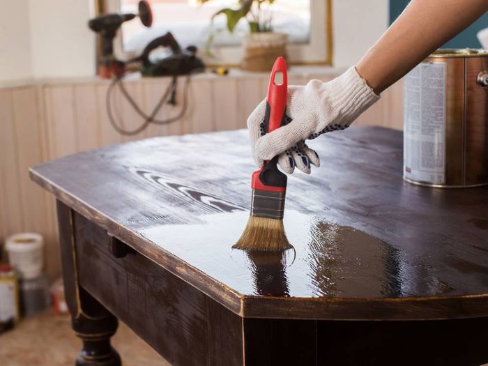 man polishing the table top