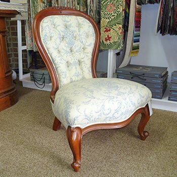 View of a wooden chair with white fabric