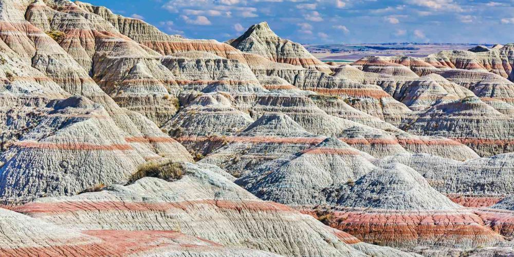 A landscape of badlands with a lot of rocks and mountains