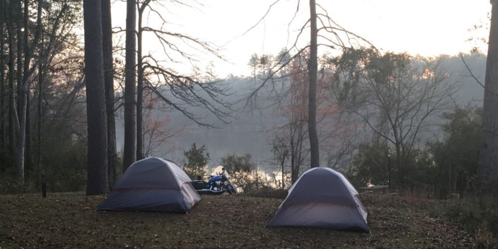 Campers setting up tents in Alabama's forests