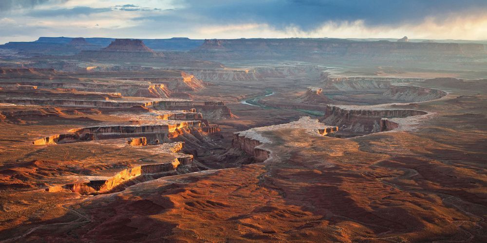 An aerial view of a canyon with a river running through it.