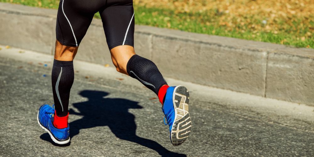 a man running wearing compression socks