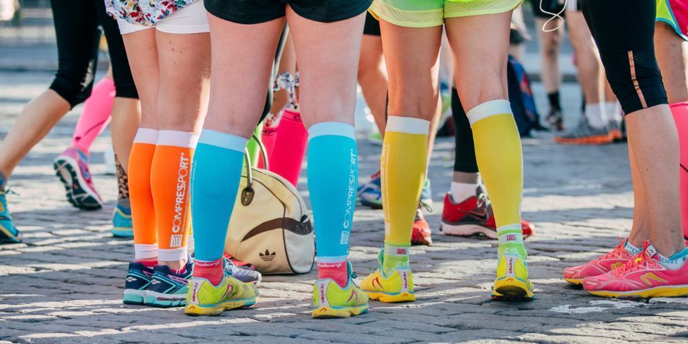 a group of runners wearing compression socks