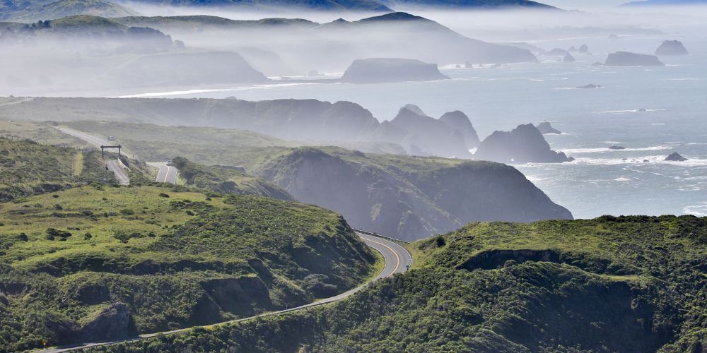 Cyclist riding along California coastal route