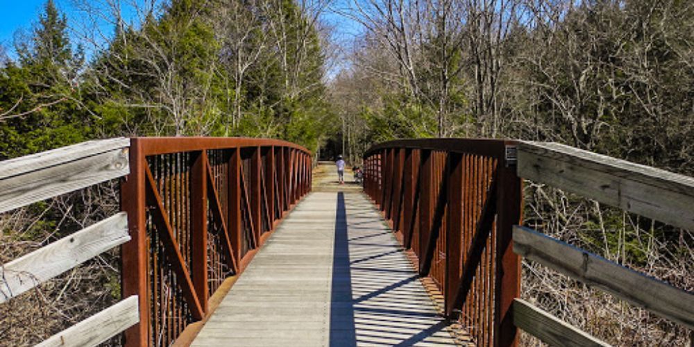 Cyclist biking along Connecticut coastal trail