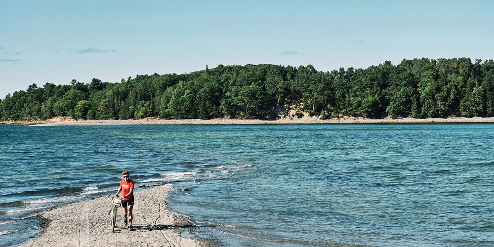 Biking through a forested path in Maine