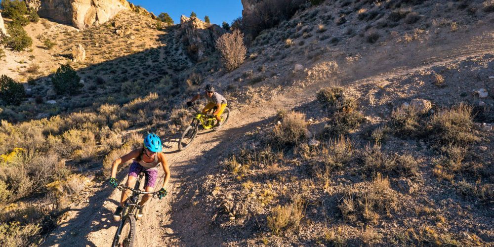 Cyclist biking through Nevada desert trail