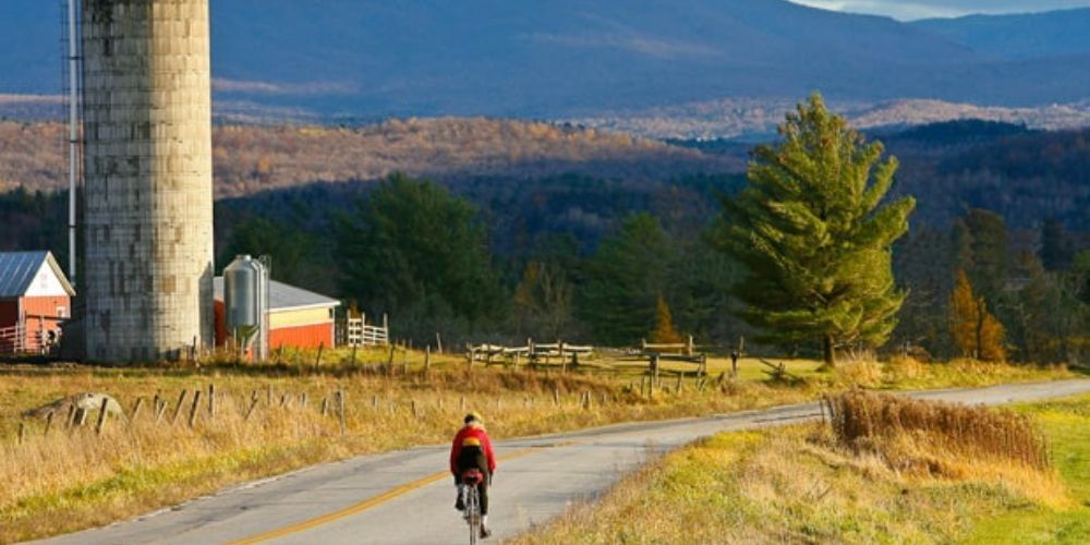 Cyclist biking along a scenic route in Vermont