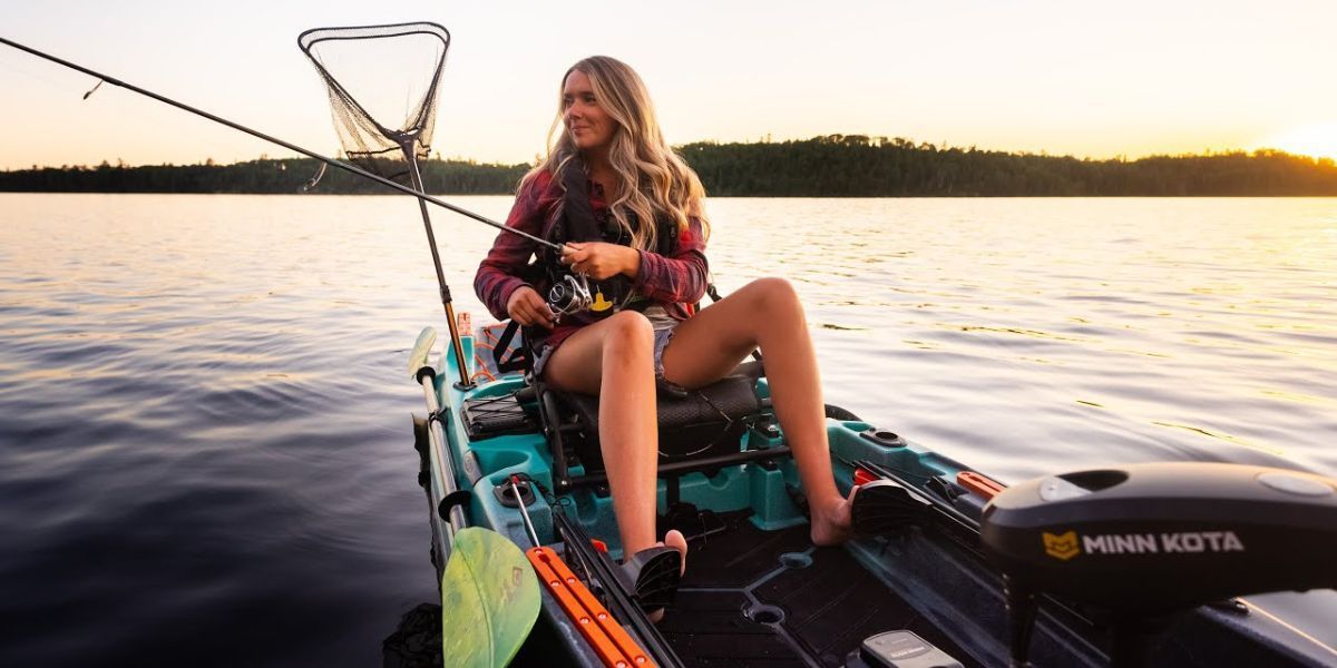 woman fishing from a kayak