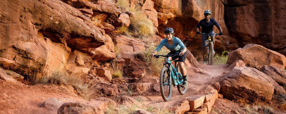 woman and man mountain biking