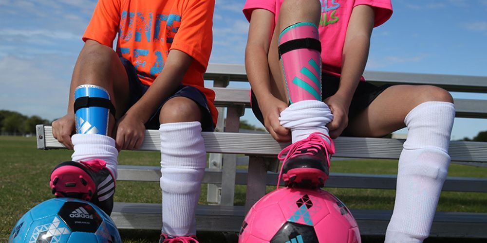 Soccer shin guards on a player's legs