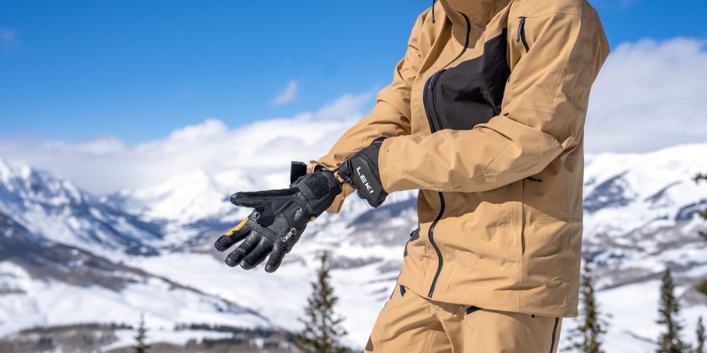 Close-up of ski gloves in the snow