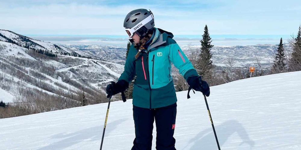 Women's ski jacket hanging on a rack