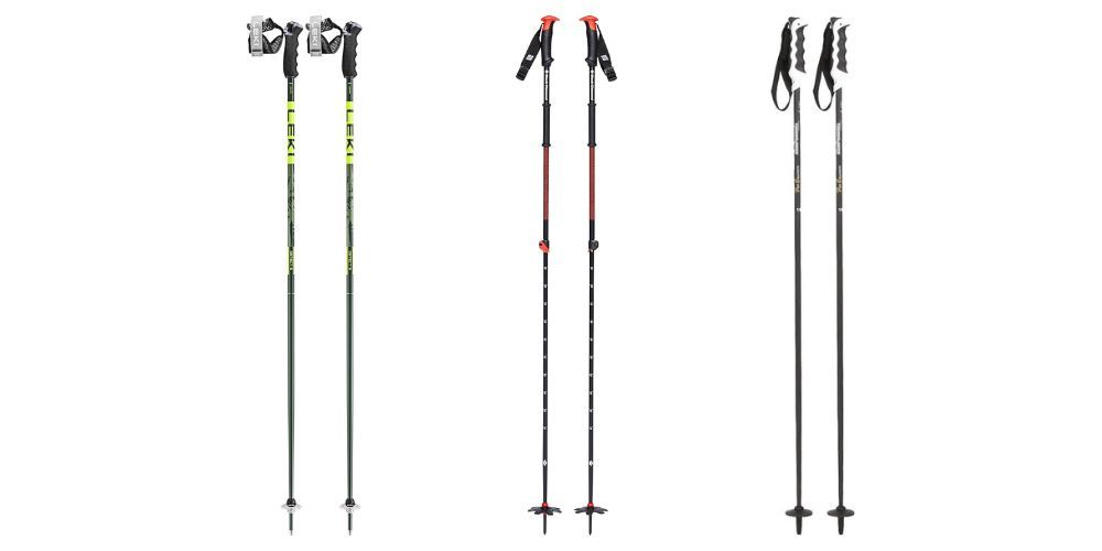 Ski poles leaning against a snowy tree