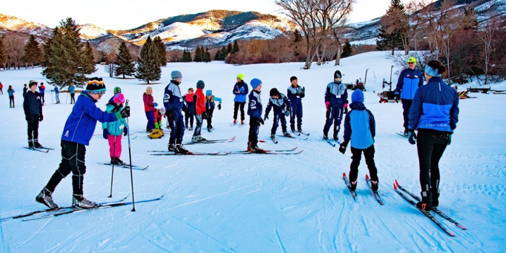 A group of people are skiing in the snow.