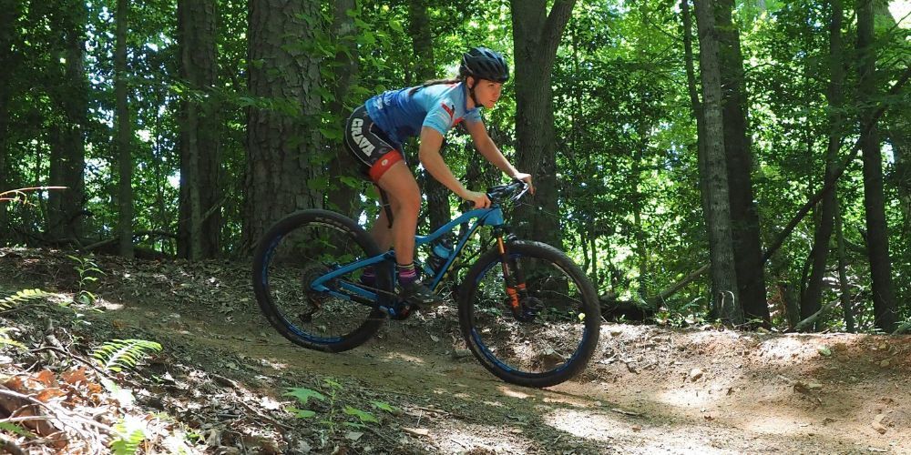 woman riding a mountain bike with mountain bike socks