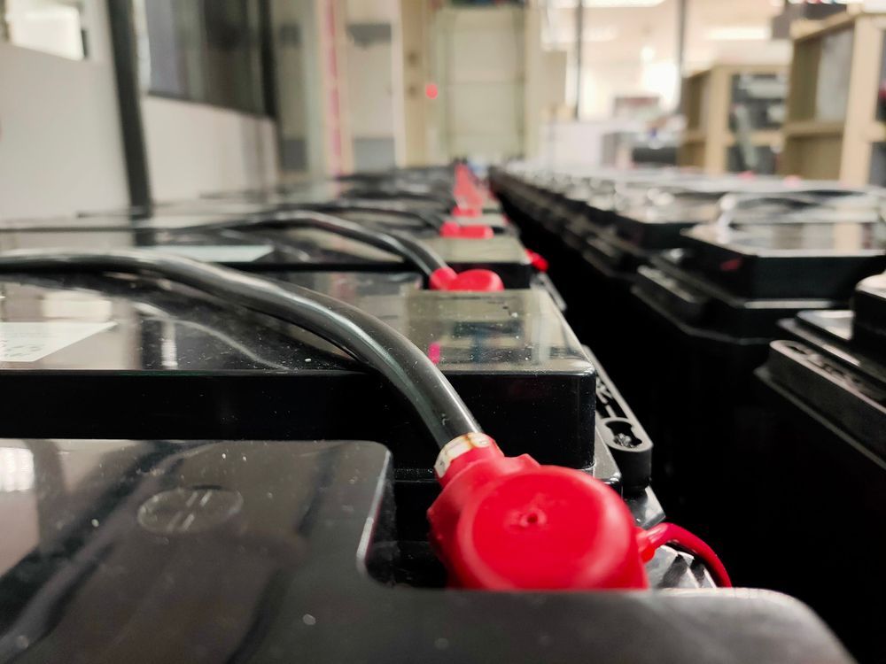 Close-up of Many Black Batteries Connected — Paul’s Tyres & Farm Maintenance in Mudgee, NSW