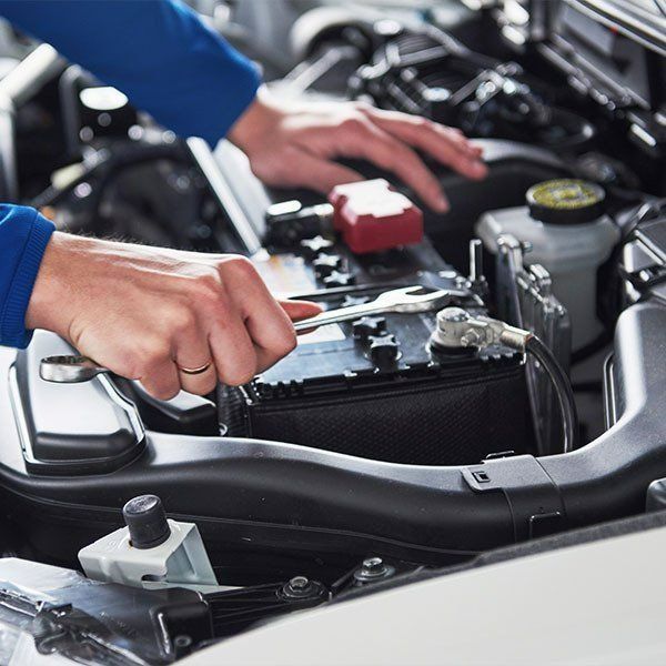 Mechanic Working on a Car Engine — Paul’s Tyres & Farm Maintenance in Apsley, NSW