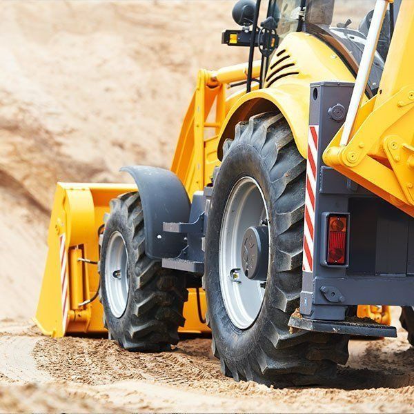 Yellow Front-end Loader on a Sandy Construction Site — Paul’s Tyres & Farm Maintenance in Apsley, NSW