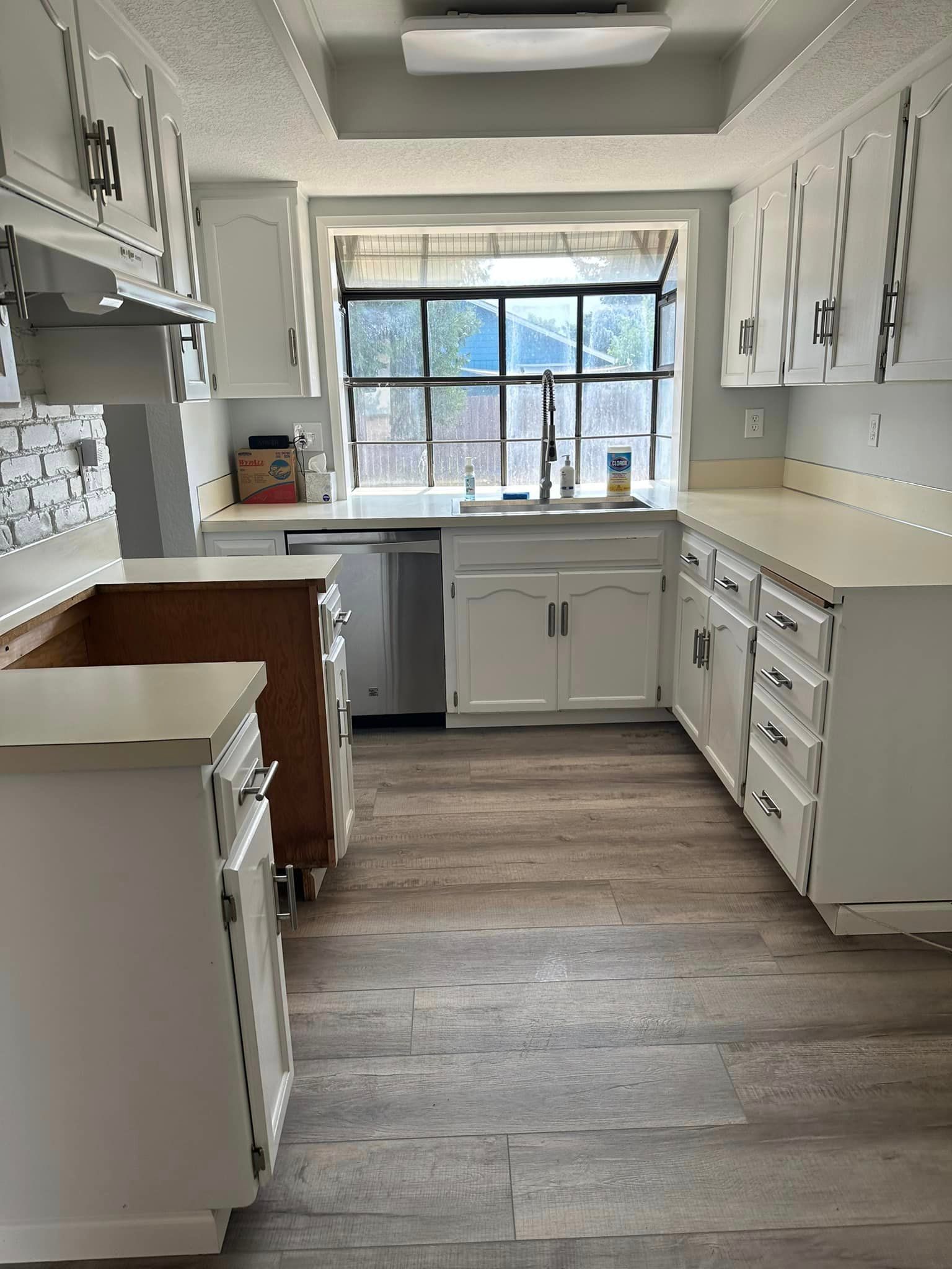 A pristine kitchen after a move-out cleaning by Infinity Professional Cleaners, showcasing countertops and floors
