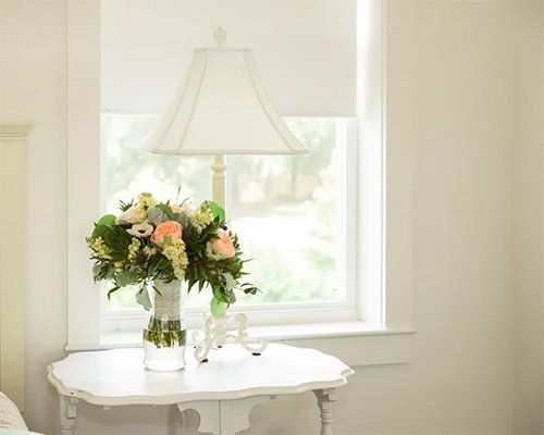 Flower on vase near window
