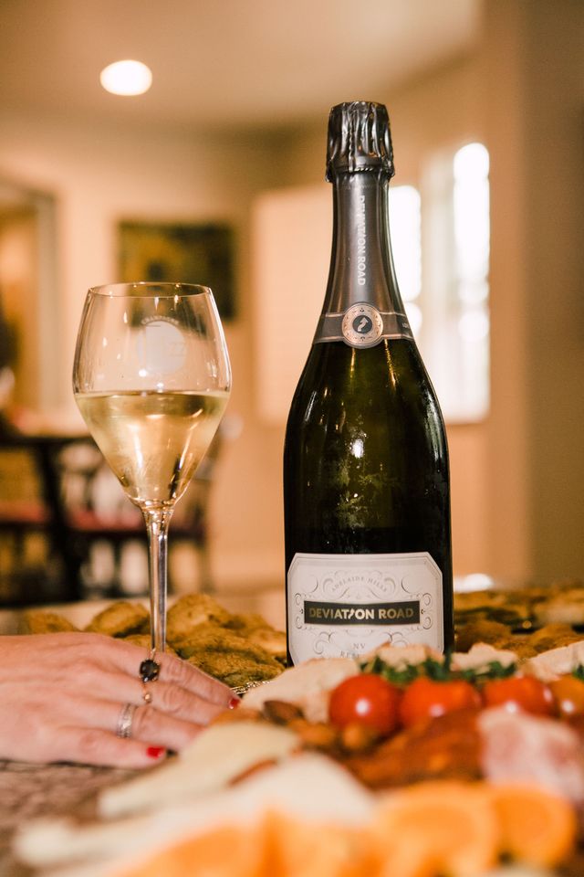 Champagne bottle at a dinner party in a home.