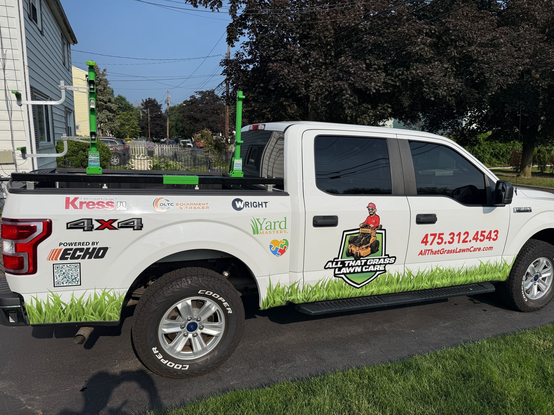 A white truck is parked on the side of the road