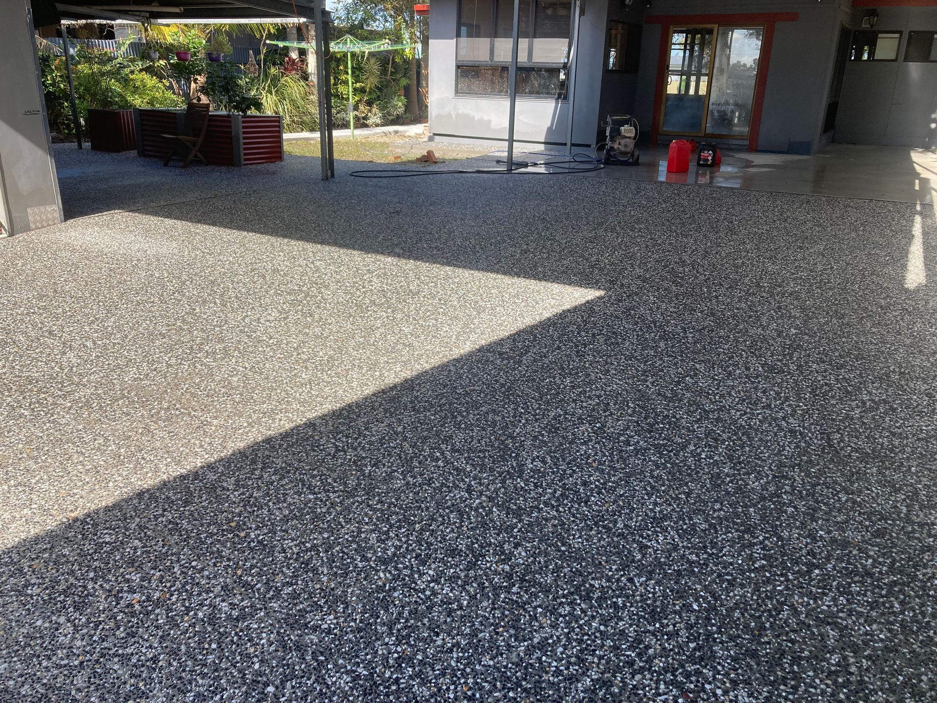 A Driveway With A Lot Of Gravel On It — Northern Rivers Concrete Construction In Pimlico, NSW