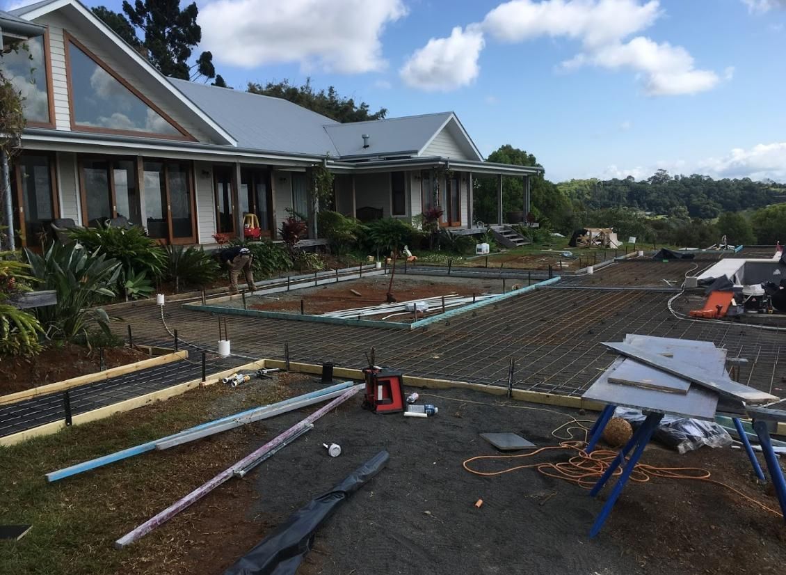 A House With A Lot Of Pipes In Front Of It — Northern Rivers Concrete Construction In Pimlico, NSW