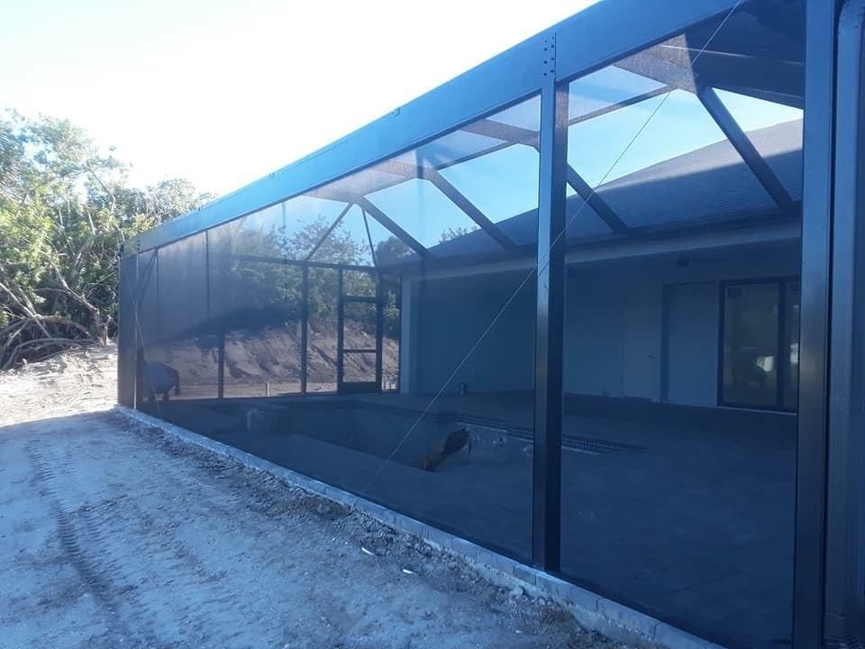 A building with a lot of windows and a screened in area.