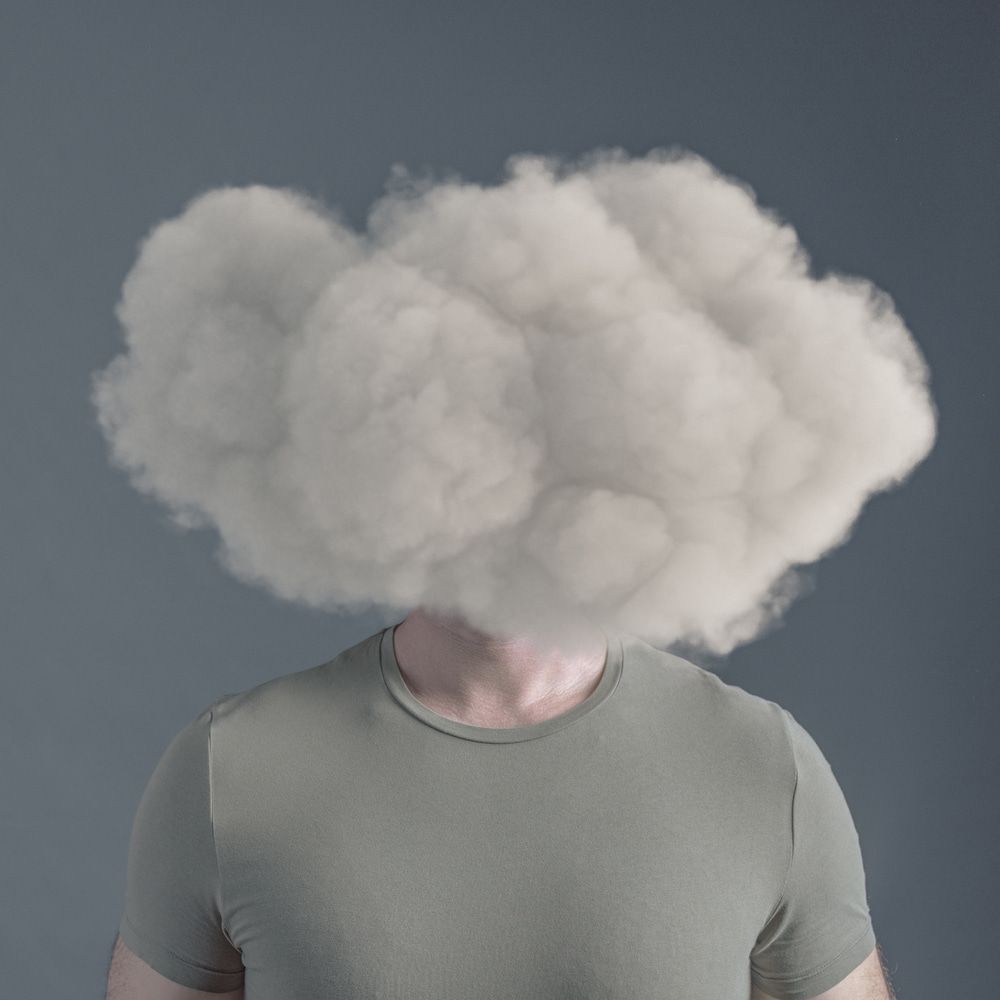 Man with a cloud coming out of his head — Treatments for Brain Fog on the Gold Coast QLD