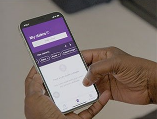 A person is holding a cell phone in their hand.