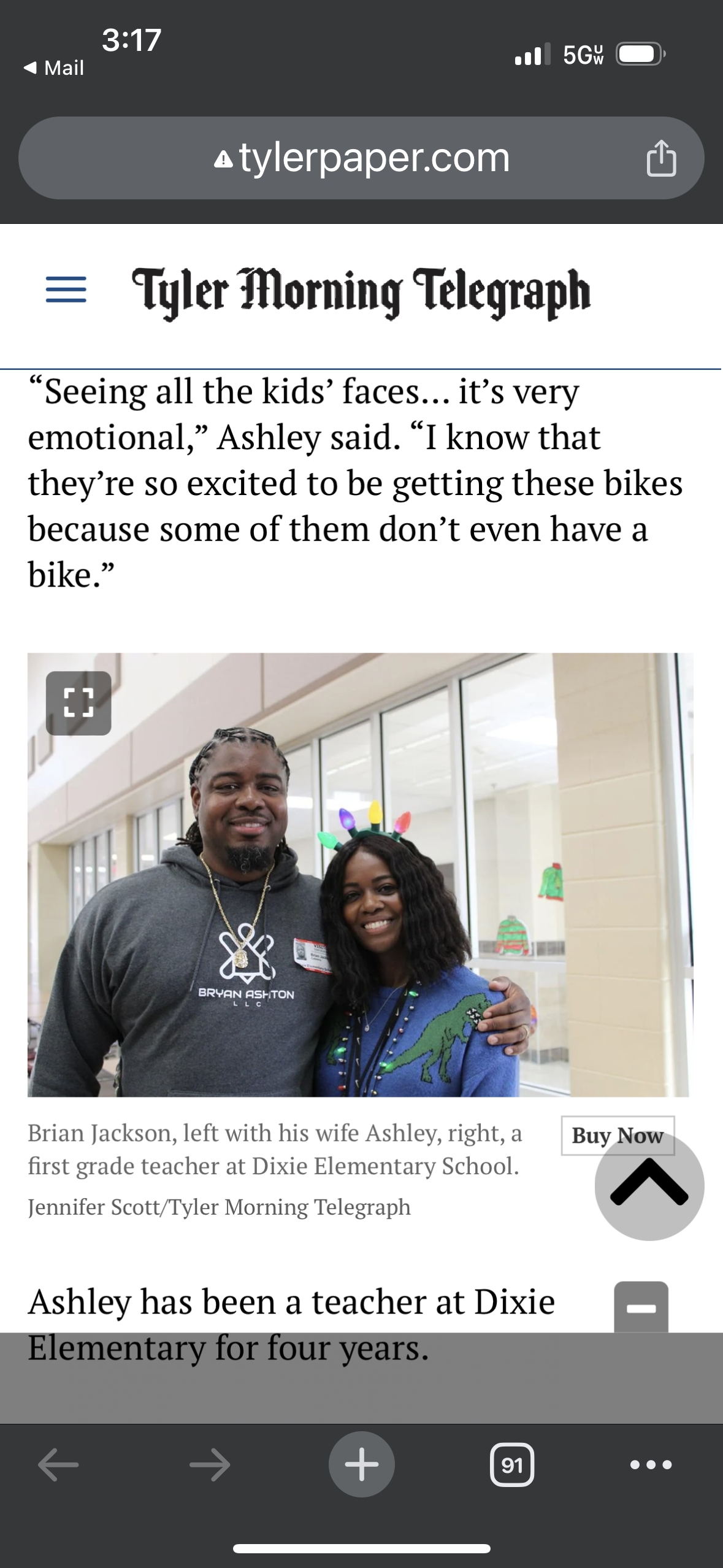 A man and a woman are standing next to each other in a hallway.