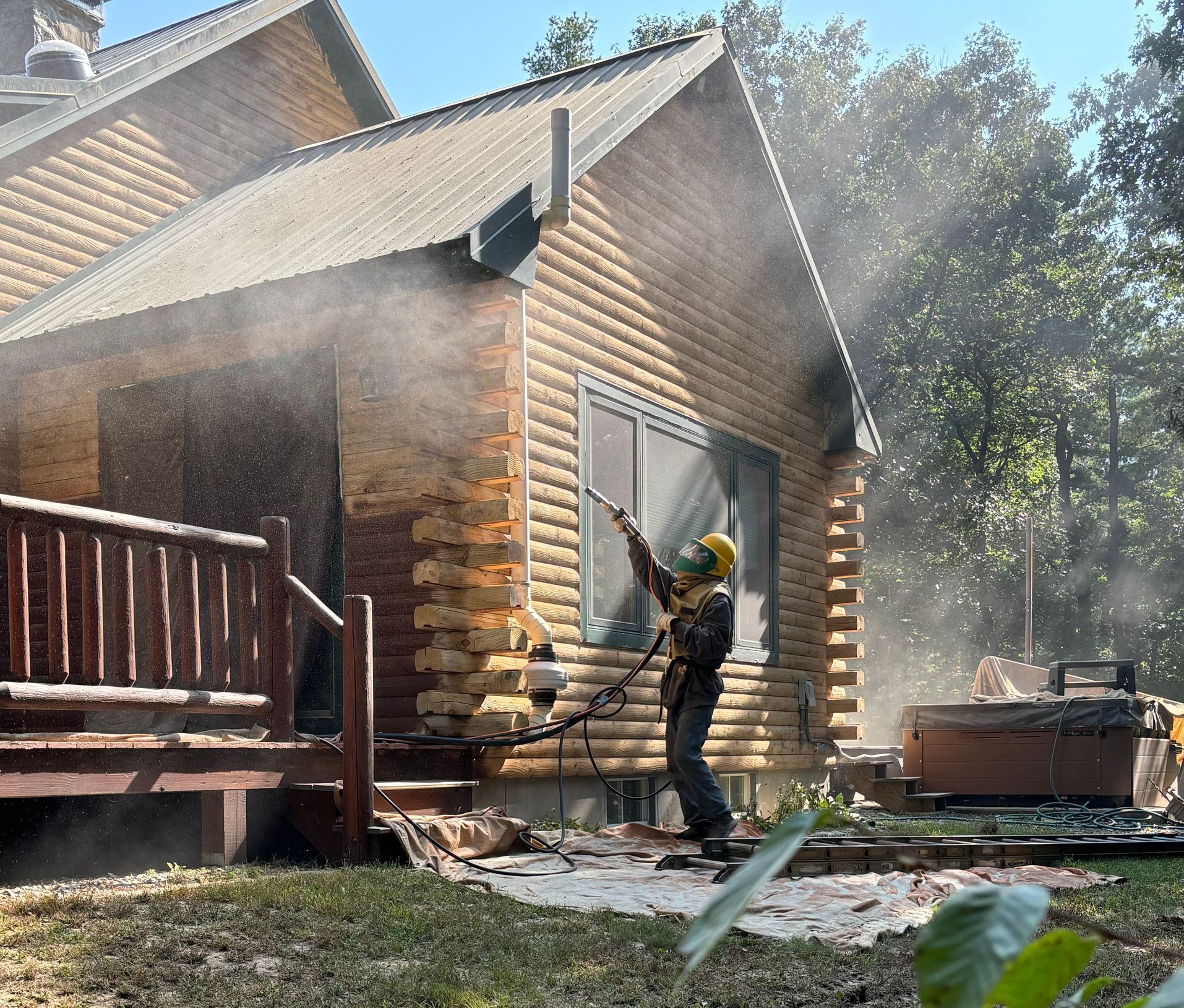 Media spraying a log cabin